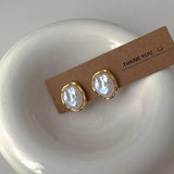 Elegantes pendientes de perlas de Carmen