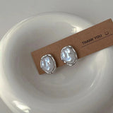 Elegantes pendientes de perlas de Carmen